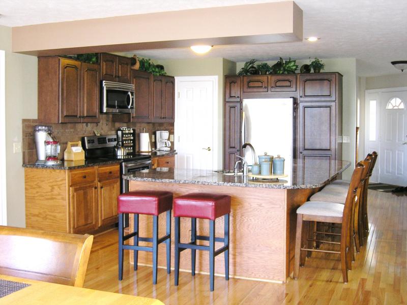 Kitchen with granite counter tops and stainless steel appliances!